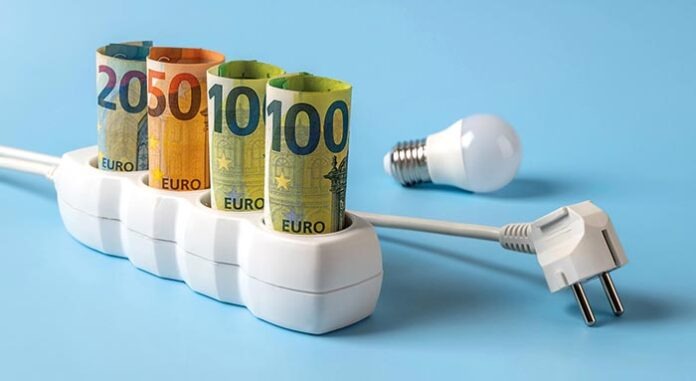 Energy price spike. Rising of electricity bill payment. Euro banknotes plugged into electrical outlet, light bulb and white power plug against blue background. High energy costs in Europe.