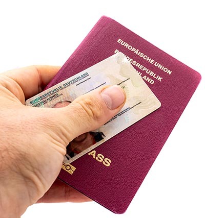 German passport with ID card isolated on white background
