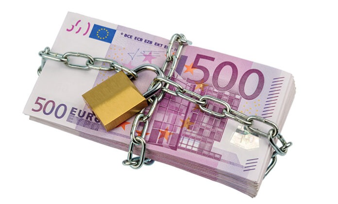 euro banknotes with chain and padlock