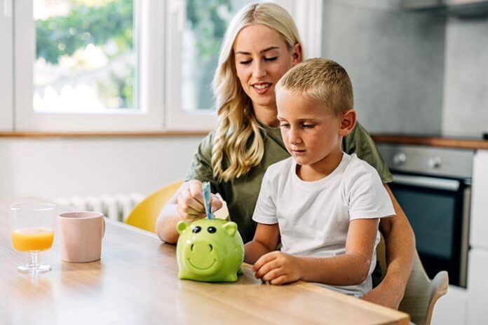 Mother teaches her son about saving money.