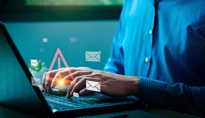 Cybersecurity Email Threat Concept with Businessman Receiving Fraudulent Messages, Highlighting Spam, Phishing Attacks, and Online Data Security Risks on Laptop, viruses, junk mail, scams