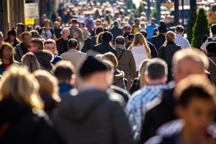 Anonymous crowd walking on a street in New York
