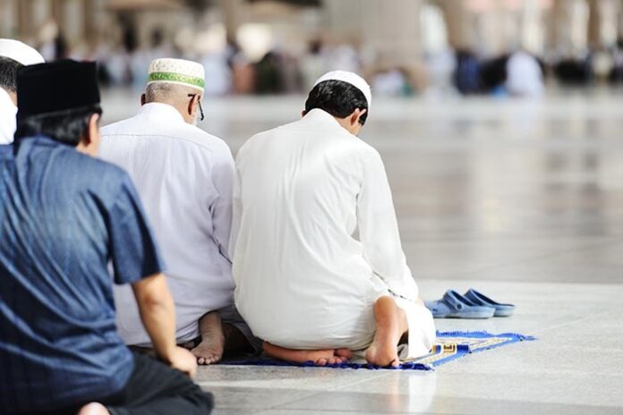Muslims praying together at Holy mosque