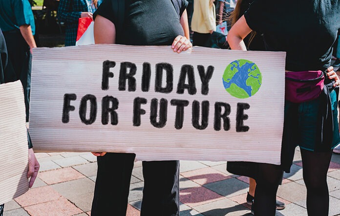 The phrase " Friday For Future " drawn on a carton banner in wom