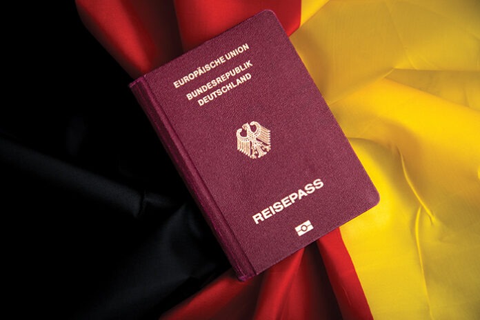 German Passport on flag of federal republic of Germany