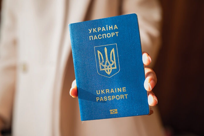 girl holding a Ukrainian passport