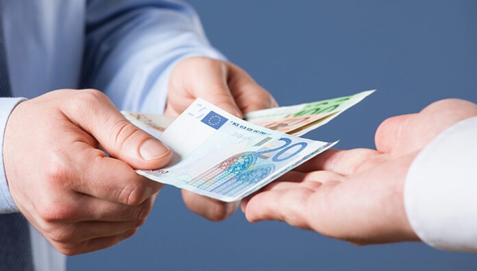 Businessman counting euro banknotes