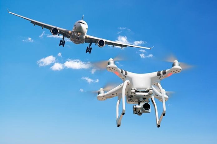 Drone flying near commercial airplane. Drone being hit by commer