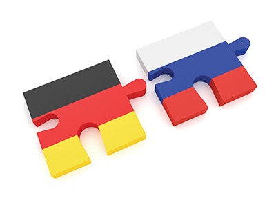 Germany Russia Partnership: German Flag And Russian Flag Puzzle