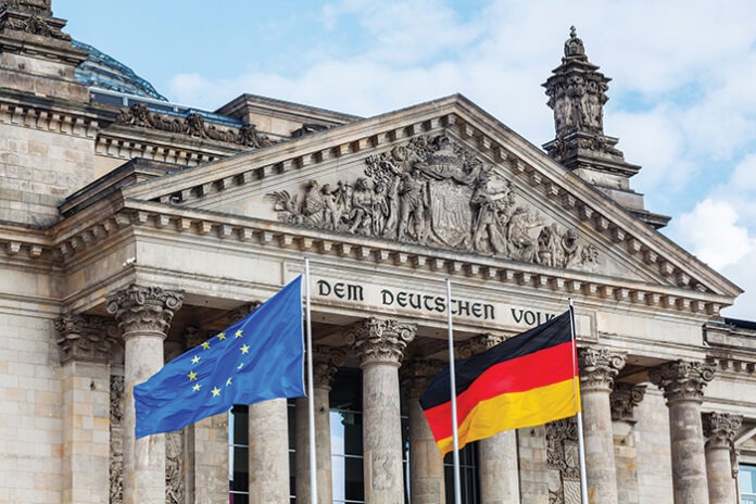 German Reichstag in Berlin, Germany, with national flags