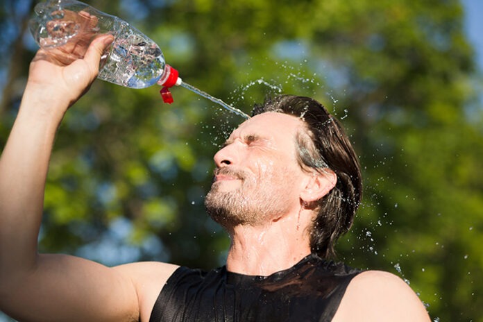 Sporty man refreshing