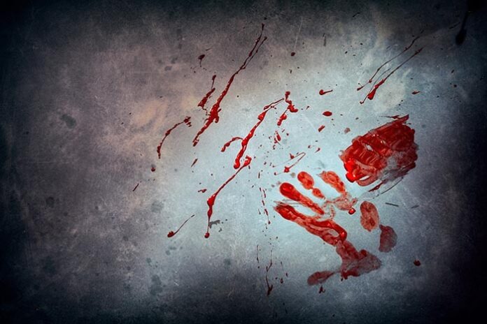 Bloody handprint with stains on wall
