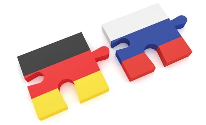 Germany Russia Partnership: German Flag And Russian Flag Puzzle
