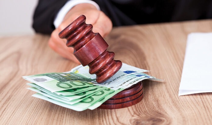 Male Judge Striking The Gavel On Euro Note