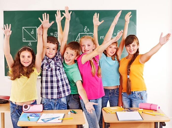 Group of school child in classroom.