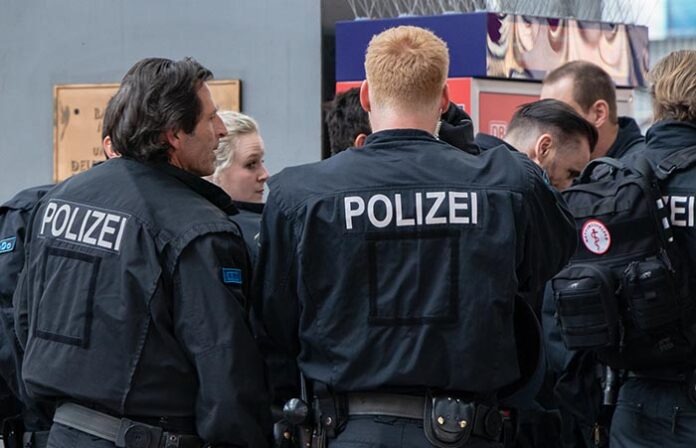 CENTRAL STATIONS, MUNICH, APRIL 6, 2019: massive police forces take care for safty of football fans in the central stations